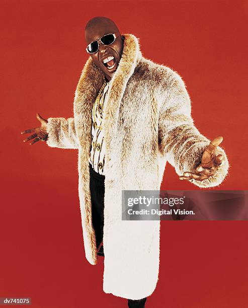 portrait of a man wearing a fur coat - fur coat stockfoto's en -beelden