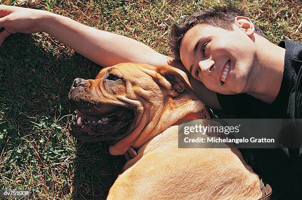 portrait of a man with his staffordshire bull terrier - staffordshire terrier stock-fotos und bilder