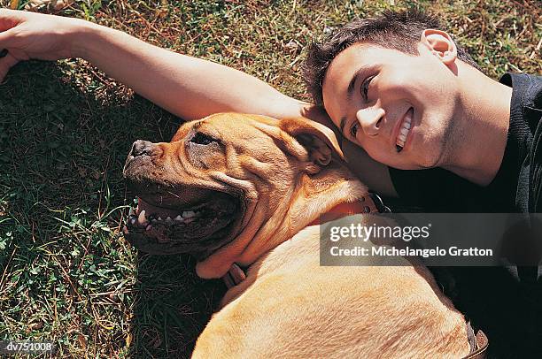 portrait of a man with his staffordshire bull terrier - bull stock-fotos und bilder