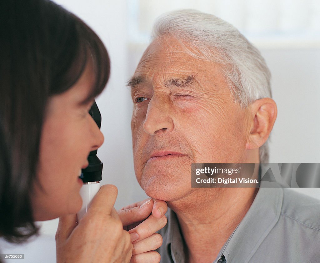 Doctor Examining Patient's Eye With a Occluder