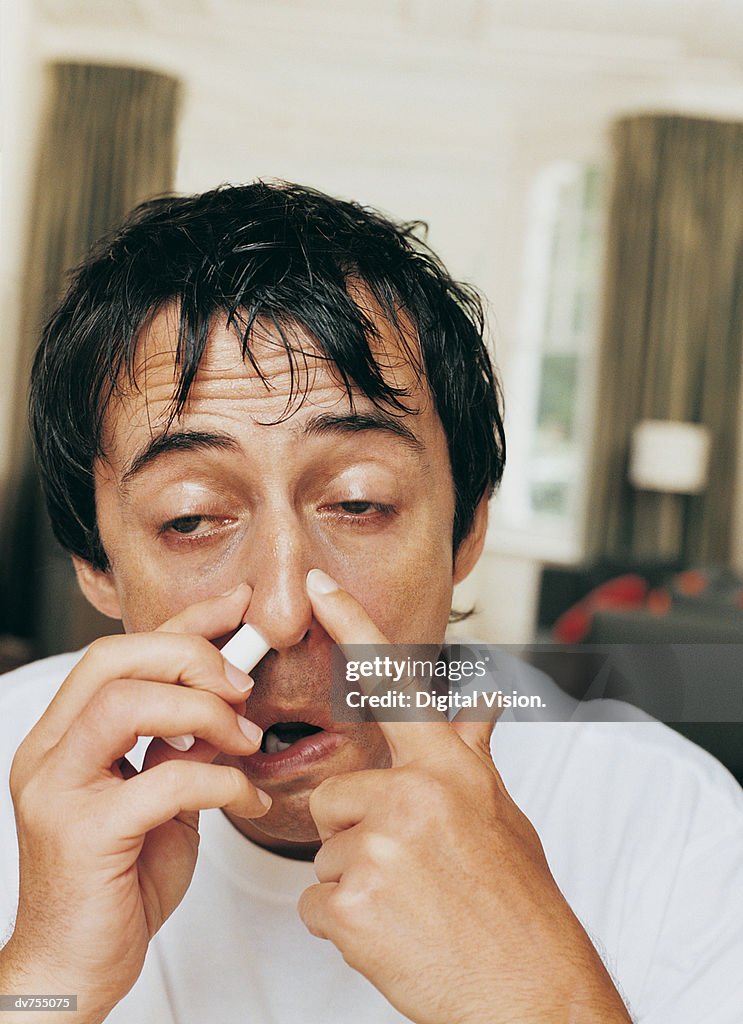 Using Nose Inhaler Man Using A Nasal Inhaler High-Res Stock Photo - Getty Images