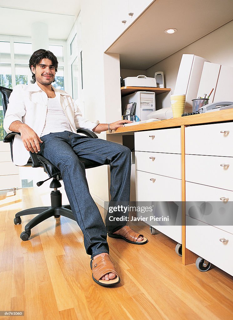 Portrait of a Businessman Sitting in a Home Office