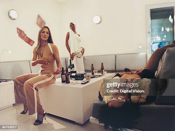 three young pop musicians in the dressing room of a tv studio - dressing up ストックフォトと画像