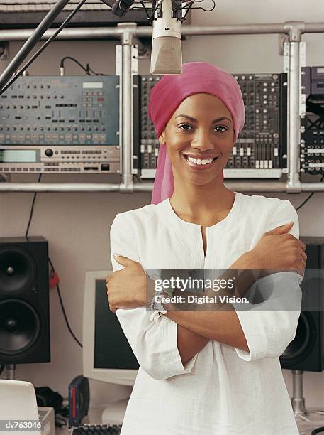 portrait of a pop singer in a recording studio - pop singer stock pictures, royalty-free photos & images