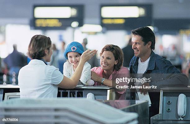 family standing at the airport check in - check up ストックフォトと画像