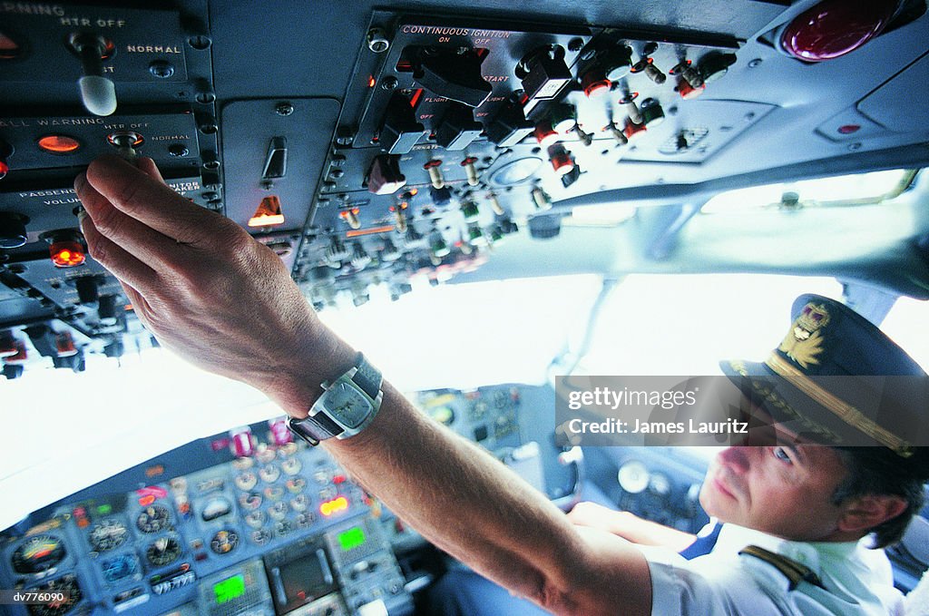 Pilot Controller Pilot Switching A Control In The Cockpit Of A Commercial Aeroplane High ...