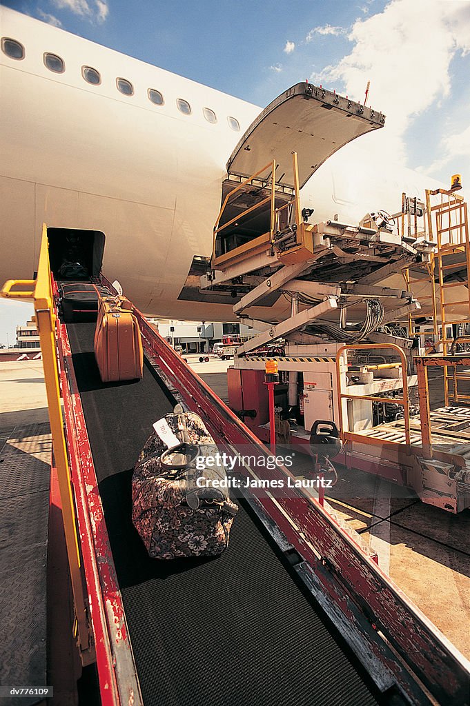 Commercial Aeroplane Unloading Its Baggage on a Runway