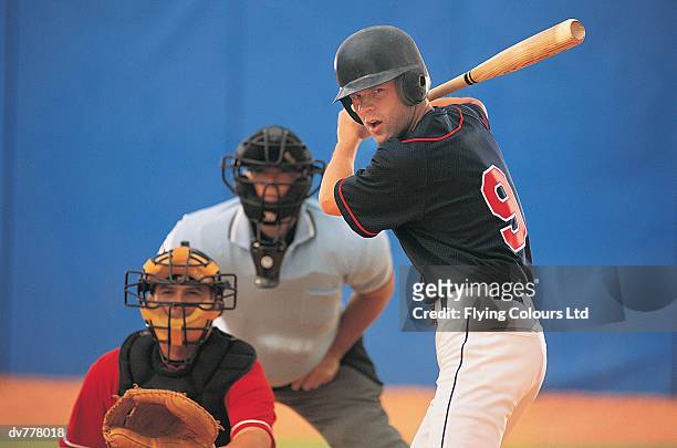 baseball batter in front of baseball catcher and umpire - catchers mitt stock pictures, royalty-free photos & images