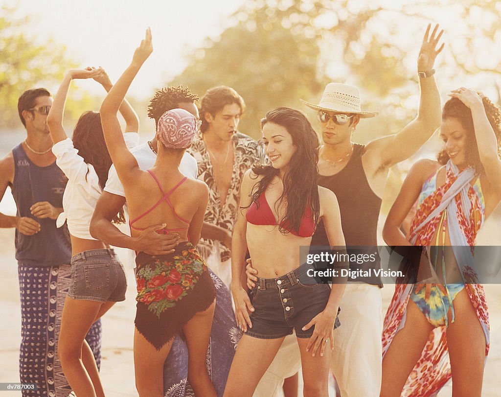People Dancing at a Beach Party