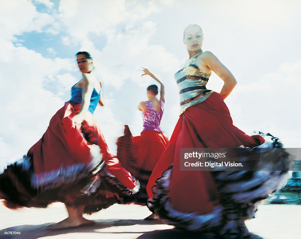 Three Women Dancing the Flamenco