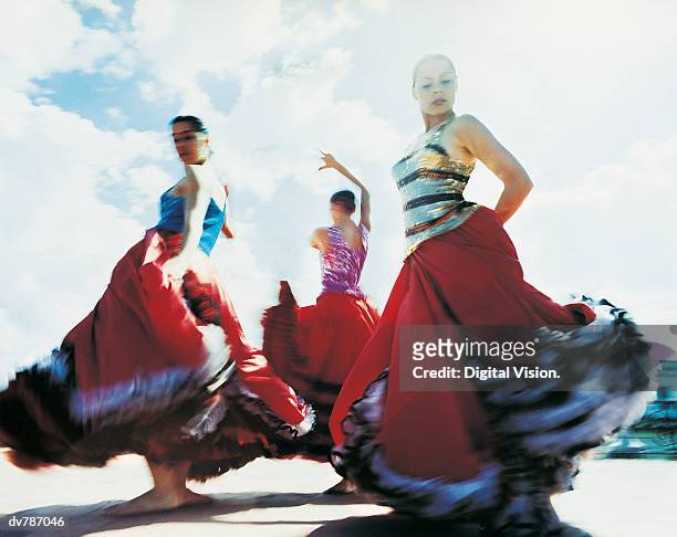 three women dancing the flamenco - flamencos stock pictures, royalty-free photos & images