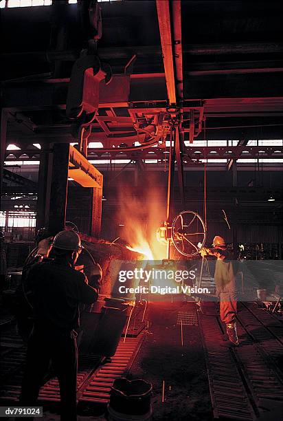 gold metal factory - foundry worker stock pictures, royalty-free photos & images