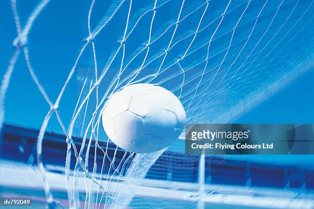 soccer ball hitting the net - ltd stock pictures, royalty-free photos & images