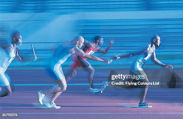 four athletes in a relay race - toma panorámica fotografías e imágenes de stock
