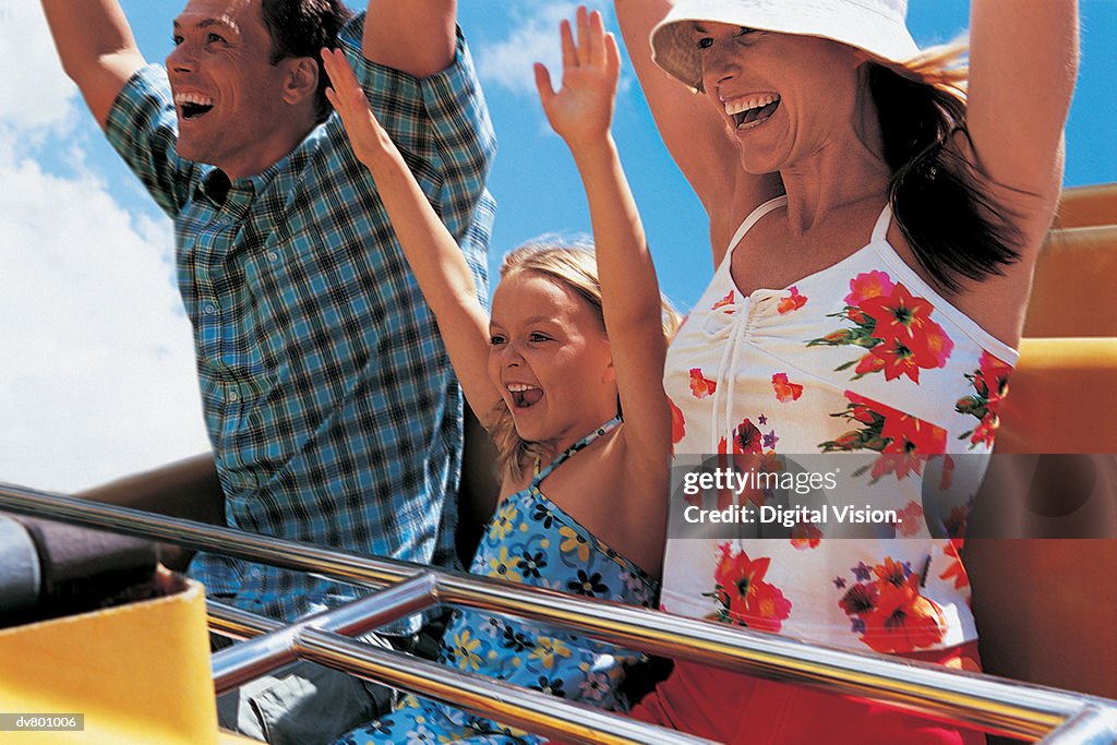 Father, Mother and Daughter on a Rollercoaster Ride