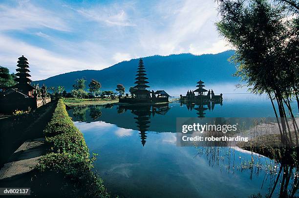 ancient hindu temple, ulu danau, lake bartan, bali, indonesia - lake bratan area fotografías e imágenes de stock