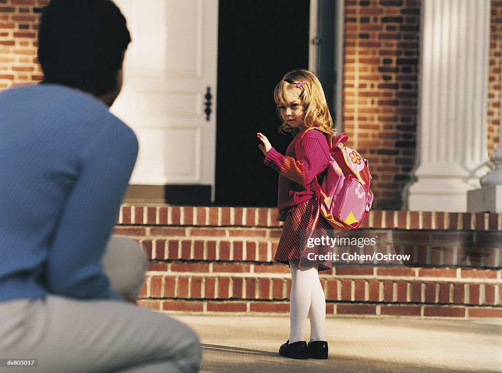 Schoolgirl Saying Goodbye to Mother on her First Day at School