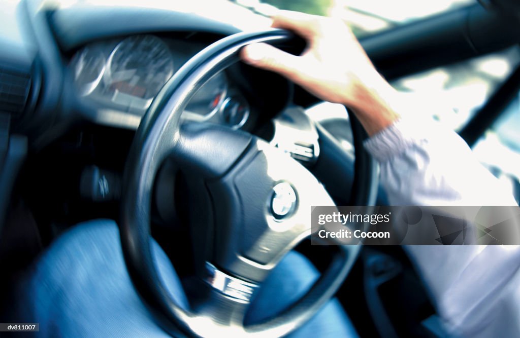 Hand on Steering Wheel
