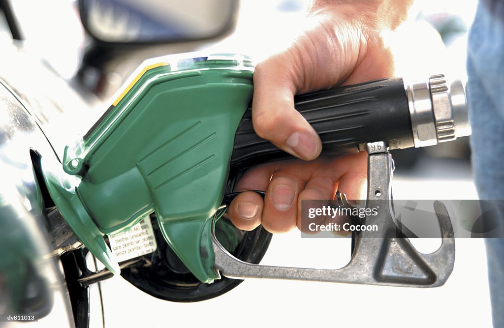 Hand Using Gas Nozzle