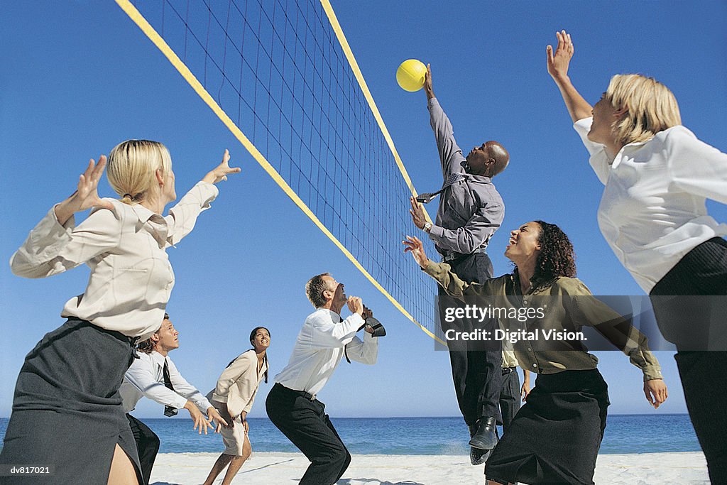 Business People Playing Volleyball
