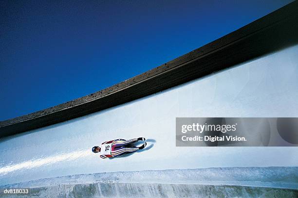 man luge racing - rennrodeln stock-fotos und bilder