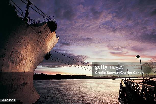 close up of cargo ship in harbour at sunset - stewart stock pictures, royalty-free photos & images