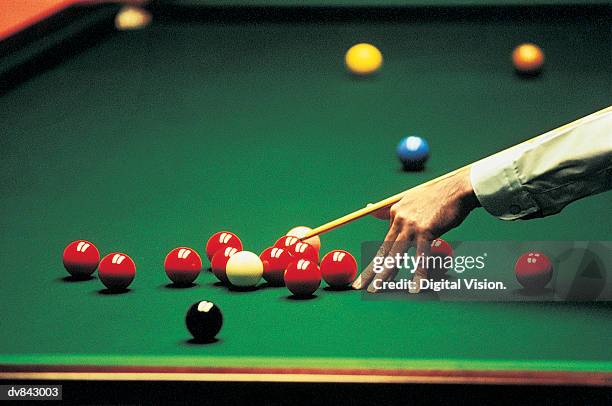 close-up of a man playing snooker - snooker stock pictures, royalty-free photos & images