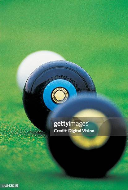 close-up of jack and two bowling balls - lawn bowling balls stock pictures, royalty-free photos & images