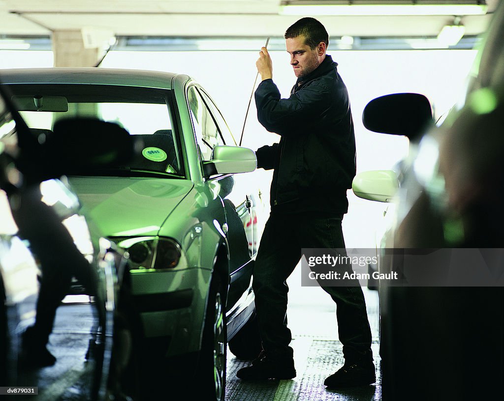 Man Committing Car Theft in a Multi Storey Car Park