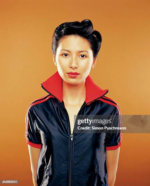 portrait of a japanese woman wearing a tracksuit top - tracksuit jacket bildbanksfoton och bilder