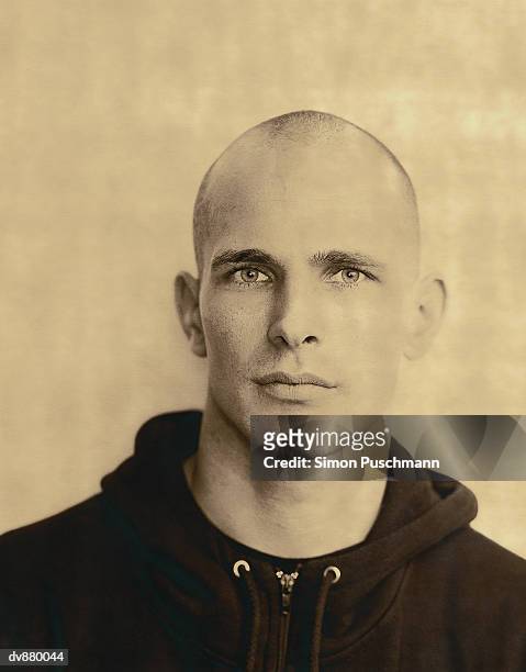 portrait of a young man with a shaved head - tracksuit top stock pictures, royalty-free photos & images