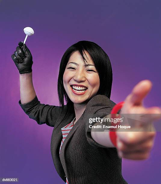 portrait of a woman smiling gesturing with her finger - formal glove stock pictures, royalty-free photos & images