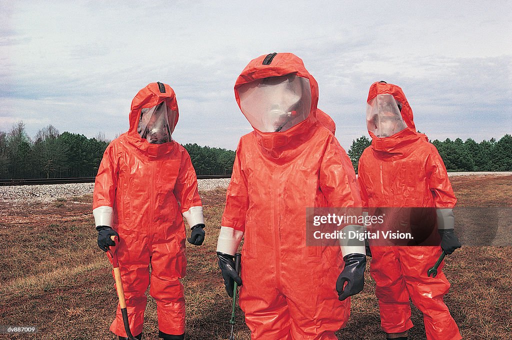 Biological Rotection Suits Three People In Biochemical Protection Suits High-Res Stock Photo ...