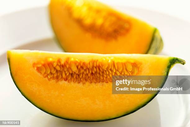 a cantaloupe wedge - rockmelon stock pictures, royalty-free photos & images