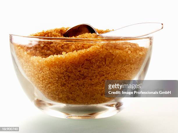 brown sugar in a glass sugar bowl - sugar bowl crockery stock pictures, royalty-free photos & images