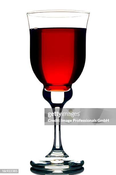 cranberry juice in stemmed glass - cranberry juice stock pictures, royalty-free photos & images