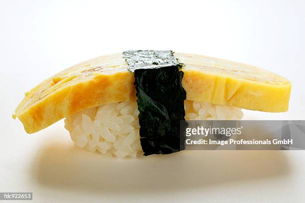 nigiri sushi with egg and nori - sushi rice stock pictures, royalty-free photos & images