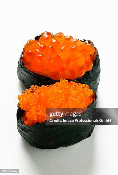 gunkan maki with two sorts of caviar - ikura stock pictures, royalty-free photos & images