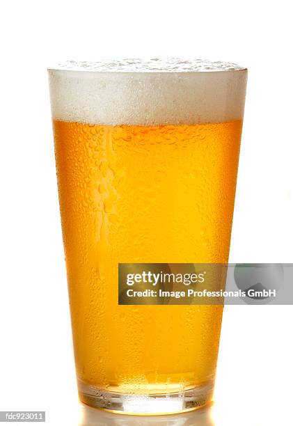 light beer in glass - lager stock pictures, royalty-free photos & images