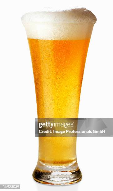 a glass of wheat beer - wheat beer stock pictures, royalty-free photos & images