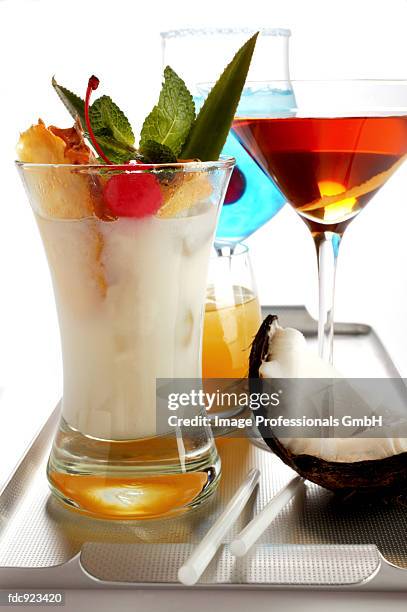 various cocktails on a tray, pina colada in front - pina stock pictures, royalty-free photos & images