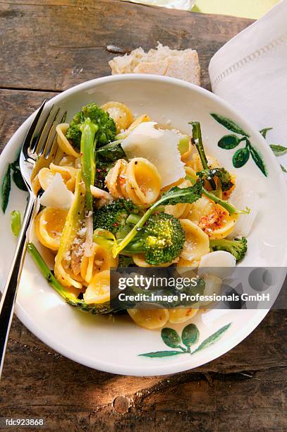 orecchiette with broccoli, chili flakes and parmesan - hard cheese stock pictures, royalty-free photos & images