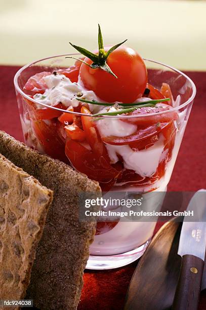 quark and tomato with crisp bread - raita stock pictures, royalty-free photos & images