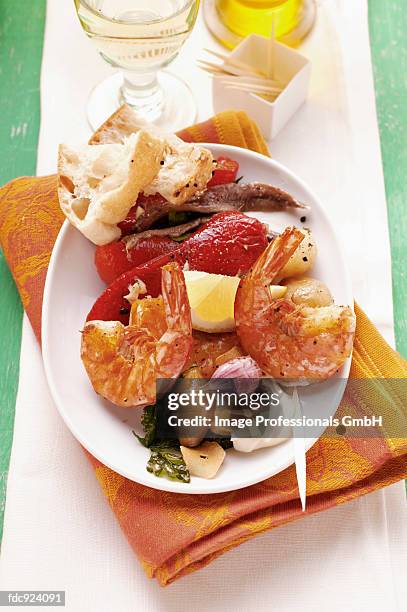 plate of appetizers with assorted tapas - broiling stock pictures, royalty-free photos & images