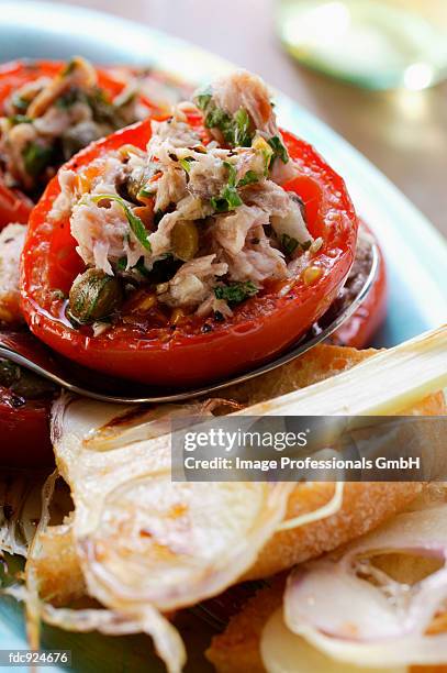 tomatoes stuffed with tuna and capers; garlic bread - garlic bread stock pictures, royalty-free photos & images