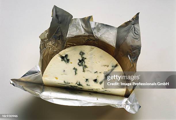 castello blue cheese with wrapper - castello stockfoto's en -beelden