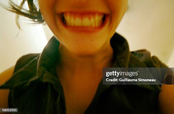 a young woman smiling - cheesy grin stock-fotos und bilder