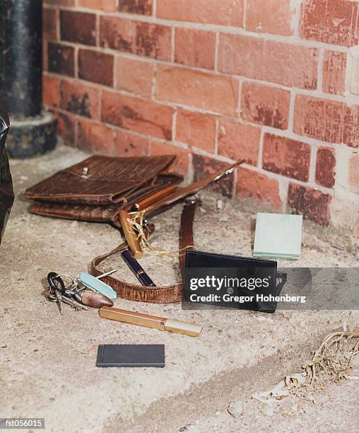 the contents of a purse spilled out - activists holds candlelight vigil to mark 1 month anniversary of oil spill stockfoto's en -beelden