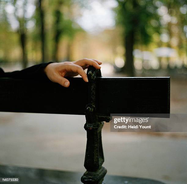 a person's hand on a bench - heidi stock-fotos und bilder