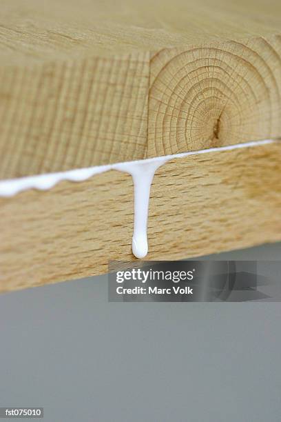 glue oozing out from between two boards - marc stock pictures, royalty-free photos & images